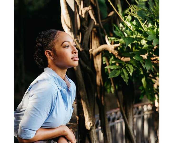 Picture Of Aleisha Allen posing for a photo with beautiful background.